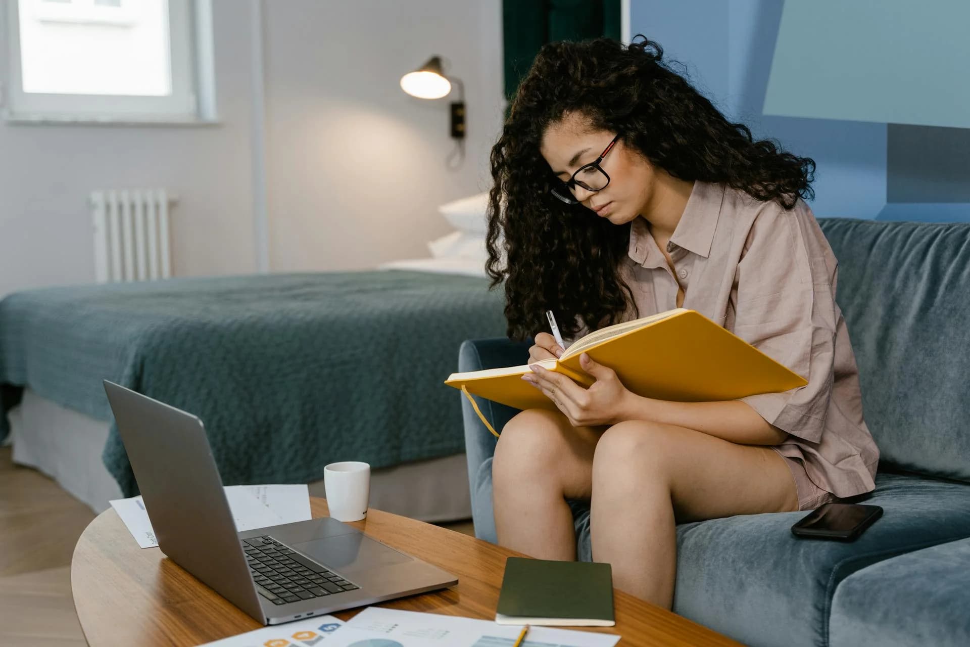 Student engaging in an online tutoring session from a comfortable home study environment