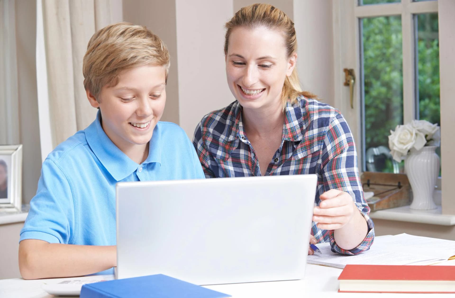 Parent and student in online tutoring session in Seeb